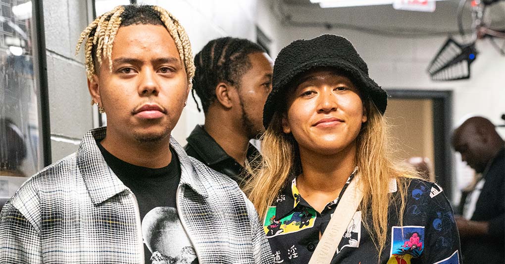 Cordae and Naomi Osaka pose after the WBA World Lightweight Championship title bout