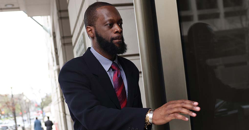 Pras Michel, a member of the 1990's hip-hop group the Fugees, arrives at U.S. District Court